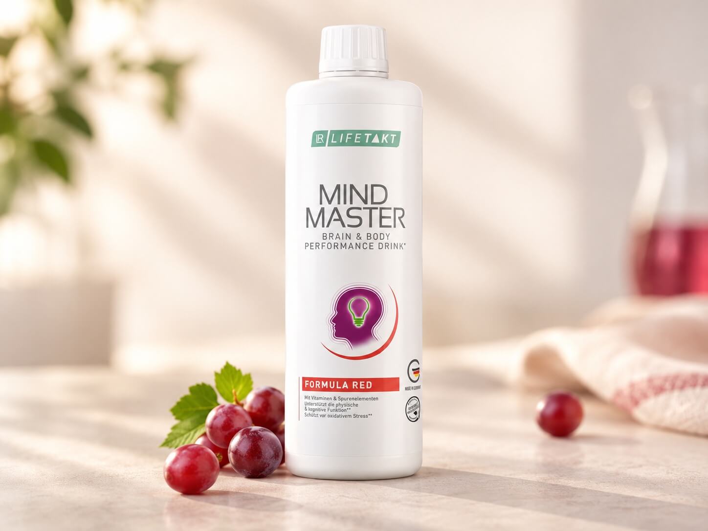 Bottle of Mind Master Formula Red performance drink on table